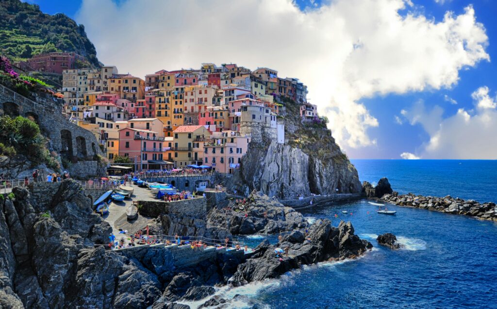 Stunning view of the Amalfi Coast in Italy, showcasing its picturesque cliffs, crystal-clear waters, and charming coastal towns—an ideal setting for romantic getaways for couples.