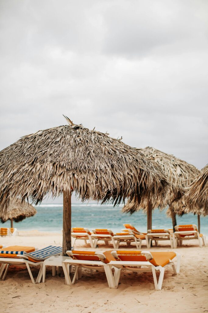 Grace Bay beach with crystal-clear waters and a nipa umbrella, showcasing one of the world's best beaches.