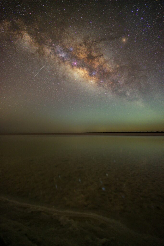 Winter night sky over the Rann of Kutch, India, featuring a breathtaking stargazing experience with countless stars shining brightly in the crisp, clear desert air, showcasing the beauty of winter tourist destinations in India.